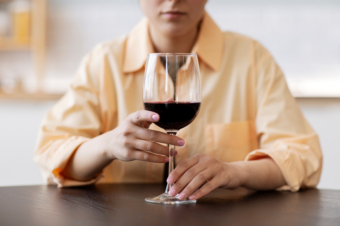 woman with a glass of wine closeup